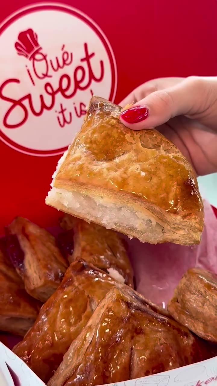 Pastelito with bite mark showing cream filling.